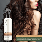 Sunny Isle Batana Leave In Detangler Conditioning 8oz with long wavy hair model promotes lustrous shine and frizz control